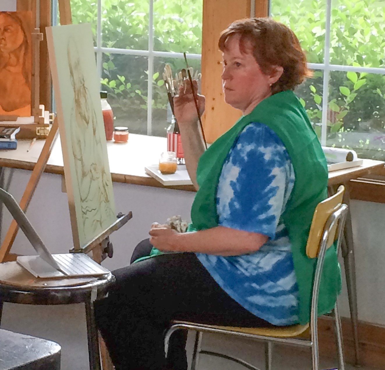 Dr. Jennifer Nelson painting in the Anderson Center Residency Studio