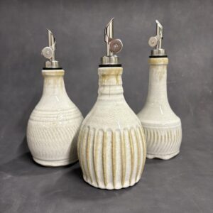 cream-colored, textured pottery bottles by Jeff McDowell for pouring oil